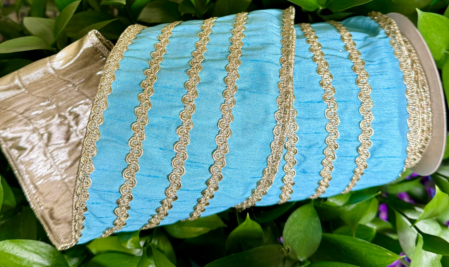 JME heavy wired ribbon. SKY BLUE DUPION with gold embroidery AND TRIM WORK. backed with platinum. 4“ x 5 yards.