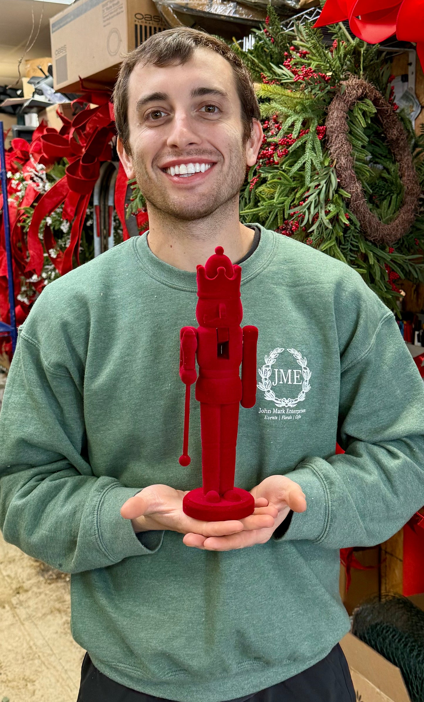 Red Velvet Nutcracker. Holding a scepter. 12 inches tall.