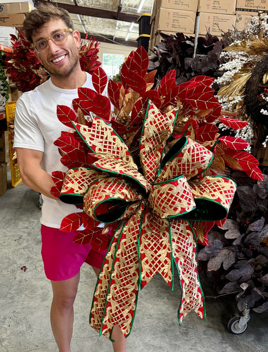 JME faux Red velvet leaf, and gold leaf wreath. With JME hand tied bow. About 24 inches wide.
