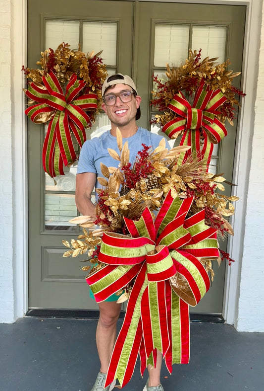 Faux gold and red regal JME Christmas wreath with hand, tied JME red and green striped velvet bow. About 24 inches wide. ￼