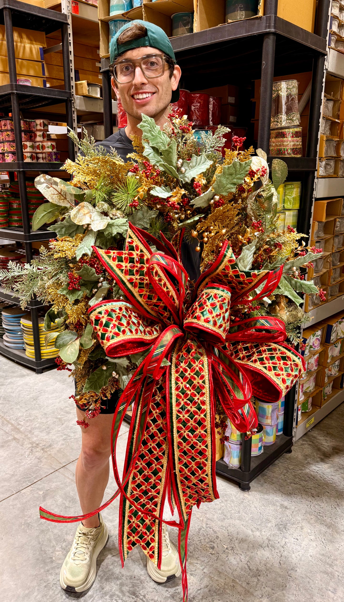 Glitz and bling handmade wreath by JME WITH JINGLE BELLS paired with a hand tied bow by JM. about 24inches wide.