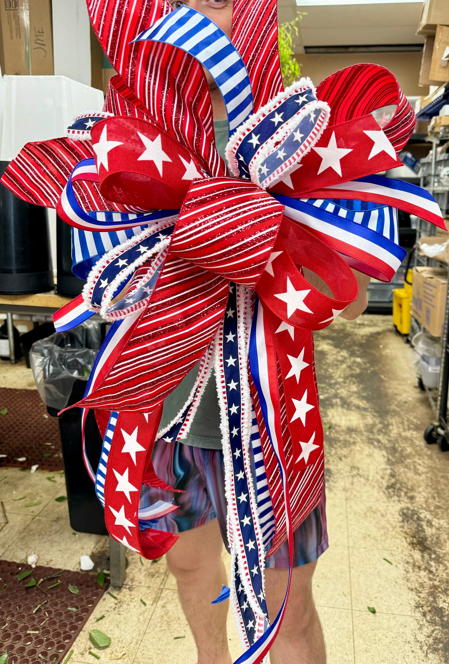 Patriotic premade bow by John Mark. Some fluffing of the bow may be required.