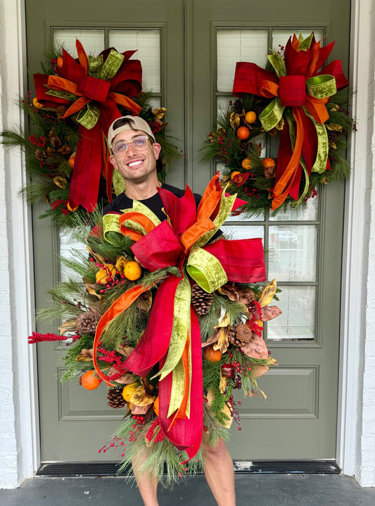 Faux Cove and fruit wreath with hand tied JME bow. About 24 inches wide.