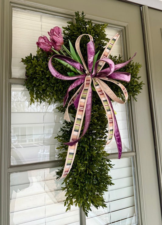 Faux Boxwood cross with purple tulip bundle and JME bow. 30inches tall 20inches wide