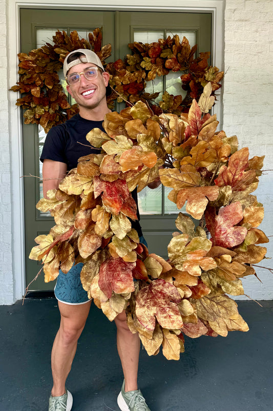 Faux oak leaf wreath with bronze brushing. About 30 inches wide.