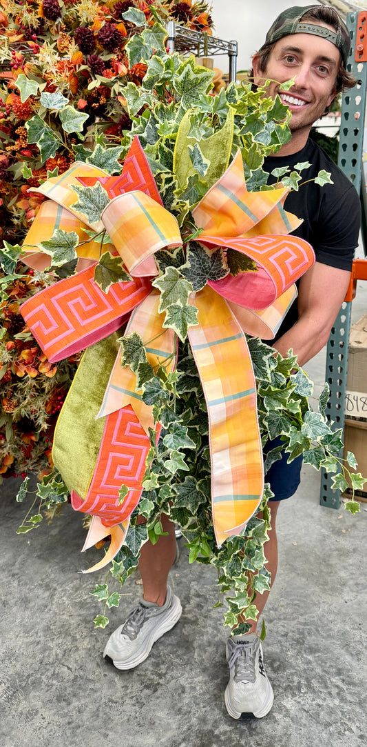Faux Ivey swags with JME hand tied bow. Approximately 50inches tall but 24 inches wide.