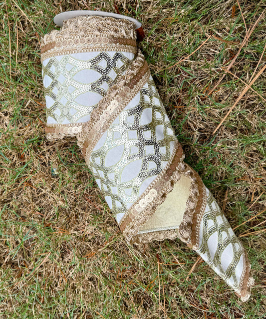 JME Heavy wired ribbon. sequin Dupion CREAM/GOLD ribbon with gold scalloped trim and a gold metallic backing. Heavy wired ribbon. 5“ x 5 yards.