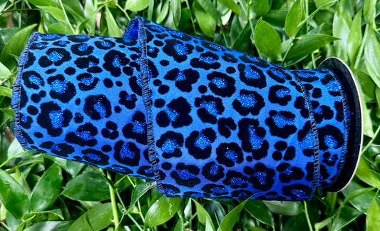 Blue glittered cheetah print wired ribbon. 4“ x 10 yards.￼