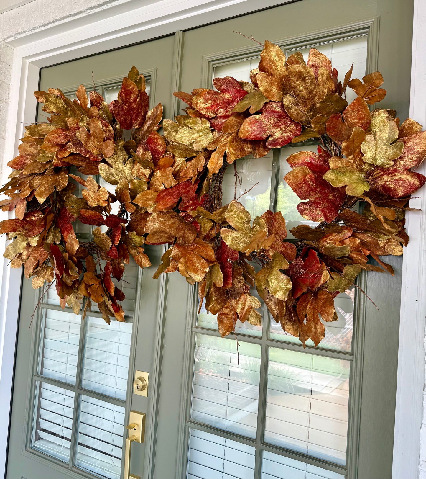 Faux oak leaf wreath with bronze brushing. About 30 inches wide.