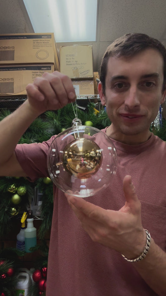 Glass ornament with GOLD sphere inside of it. 6inches in diameter